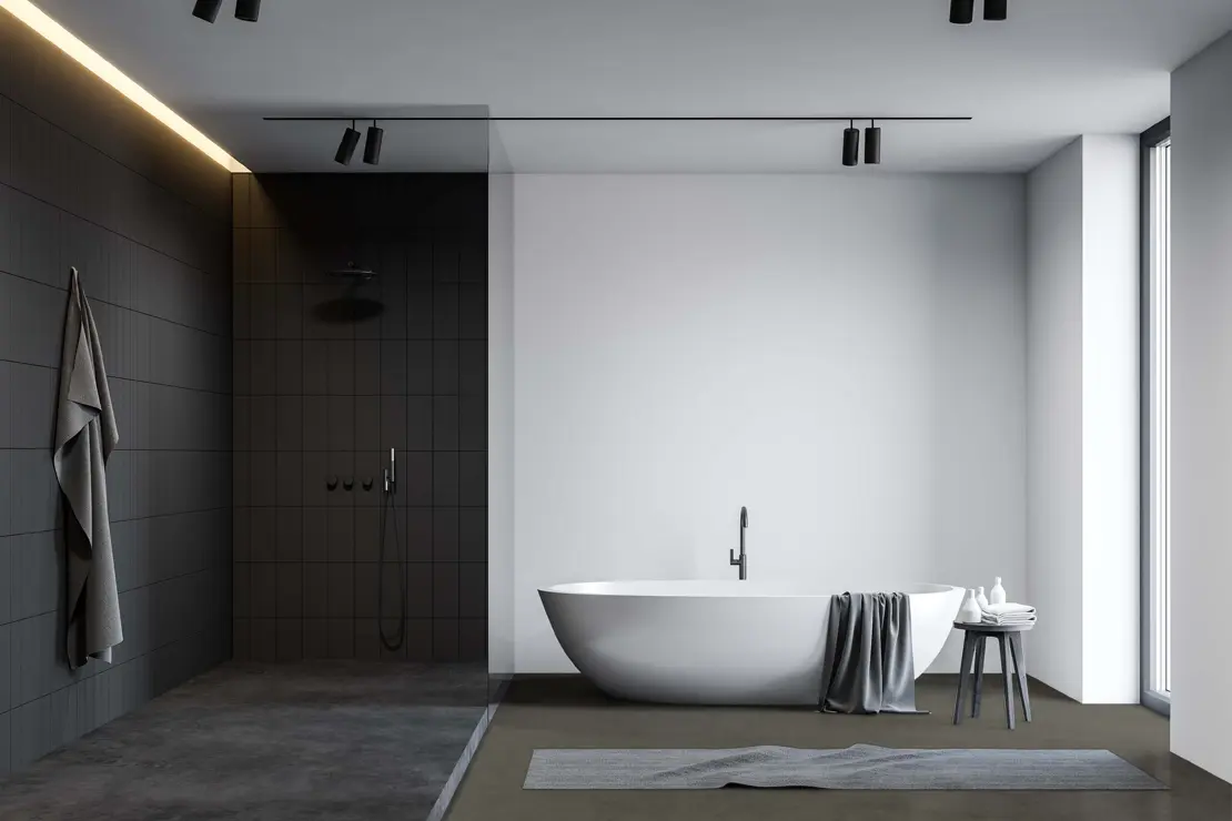 Douche avec sol en béton ciré de couleur gris foncé. Douche avec sol en béton ciré de couleur gris foncé.
